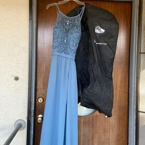 Long dress has slit in front and pockets with built up n bra